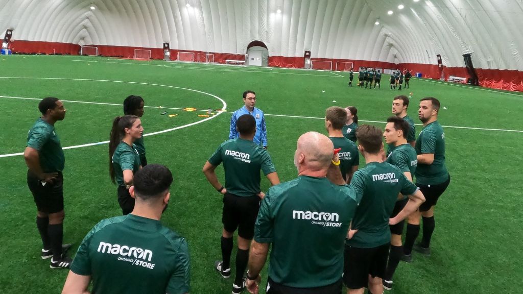 Match officials at training