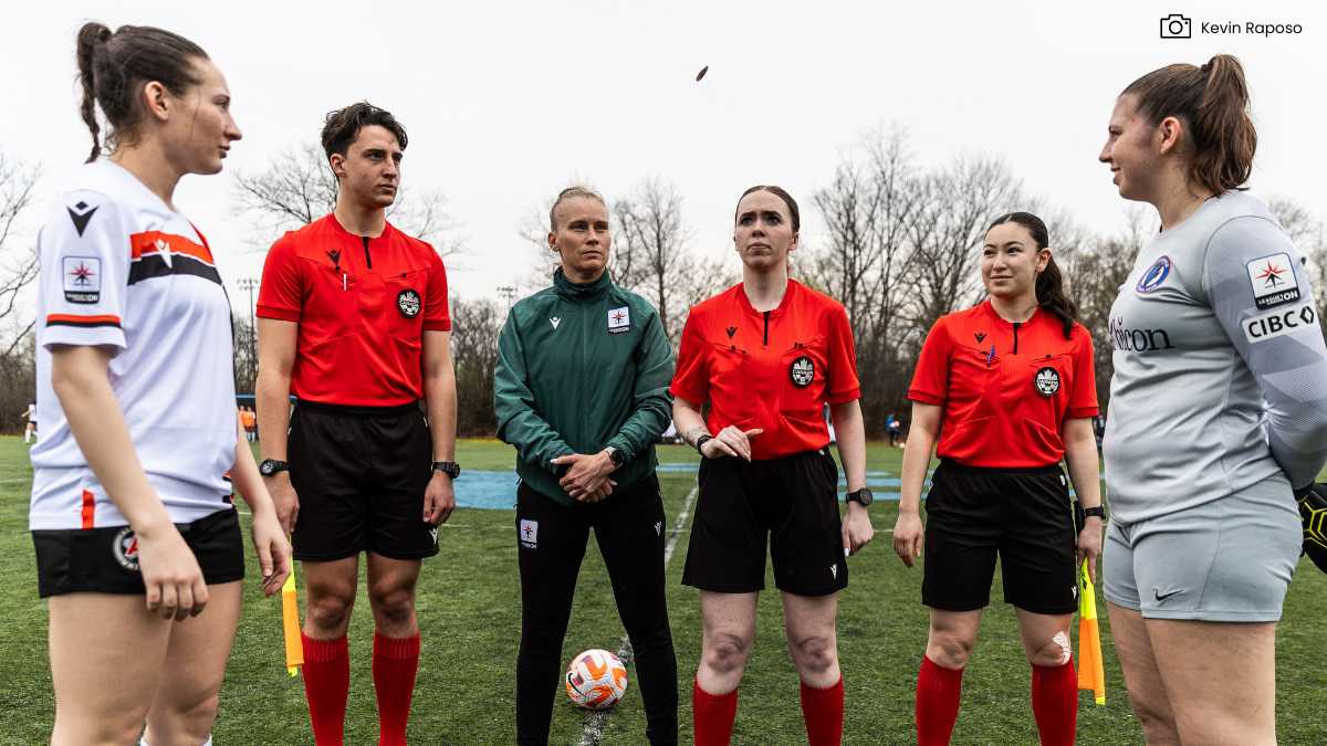 Referees conduct coin toss