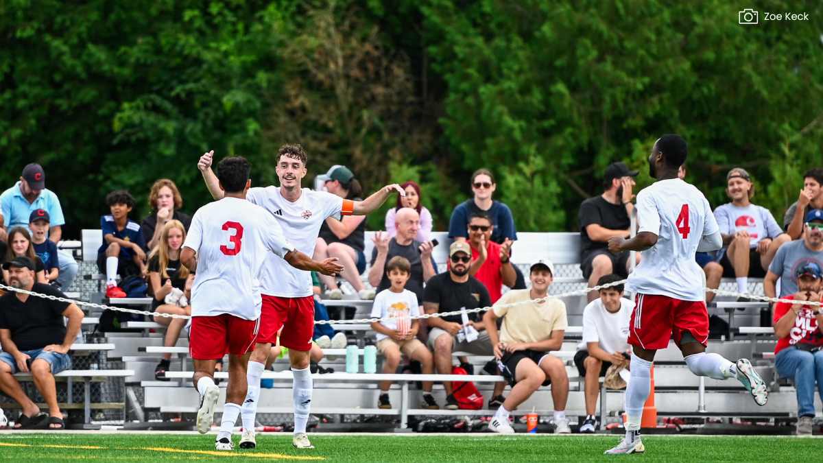 Ryan Baker celebrates with team