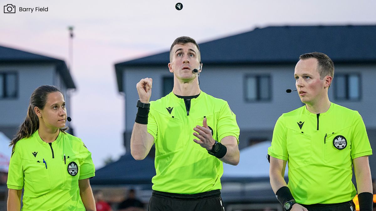 match officials flip a coin